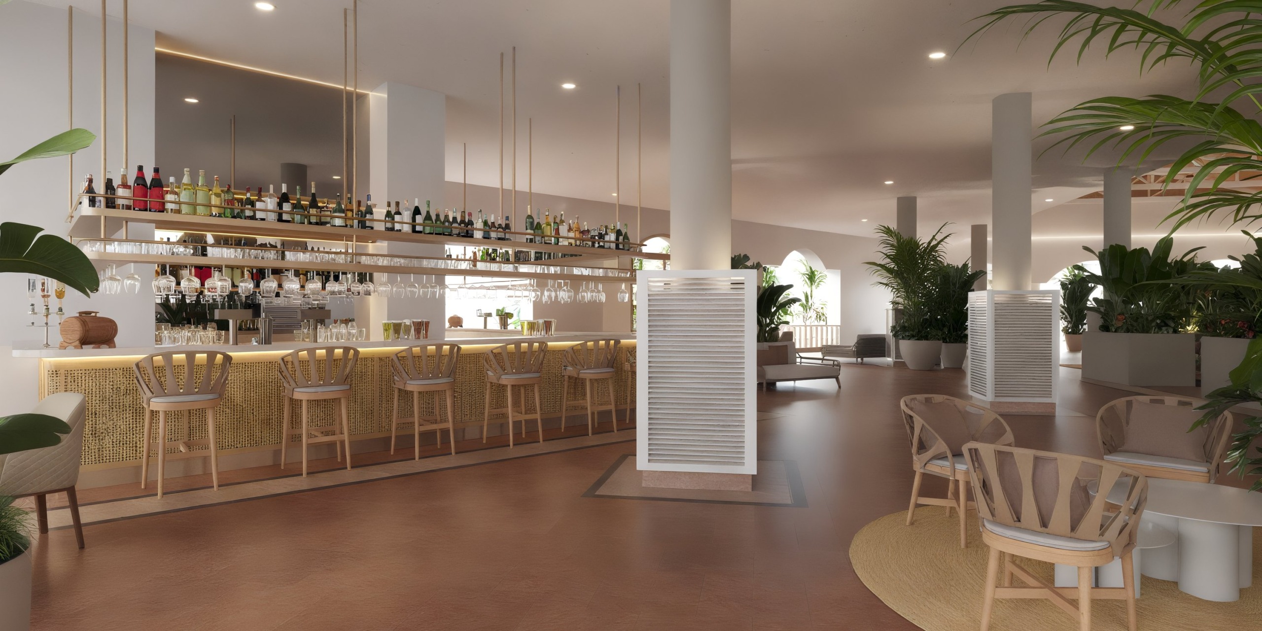 The Wyndham Alltra Punta Cana boasts a modern bar interior with wooden stools and a well-stocked counter surrounded by plants. The space features warm lighting, complemented by sleek, minimalist design elements.