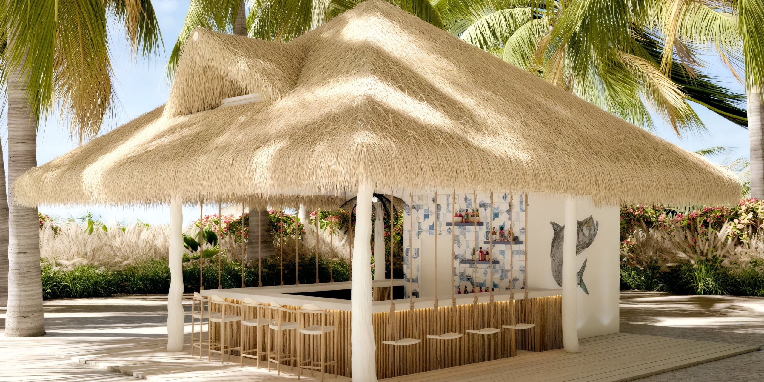 Dreams Playa Esmeralda: A picturesque tropical bar with a thatched roof and cozy stools nestled among swaying palms, creating a perfect setting for your destination wedding celebration.