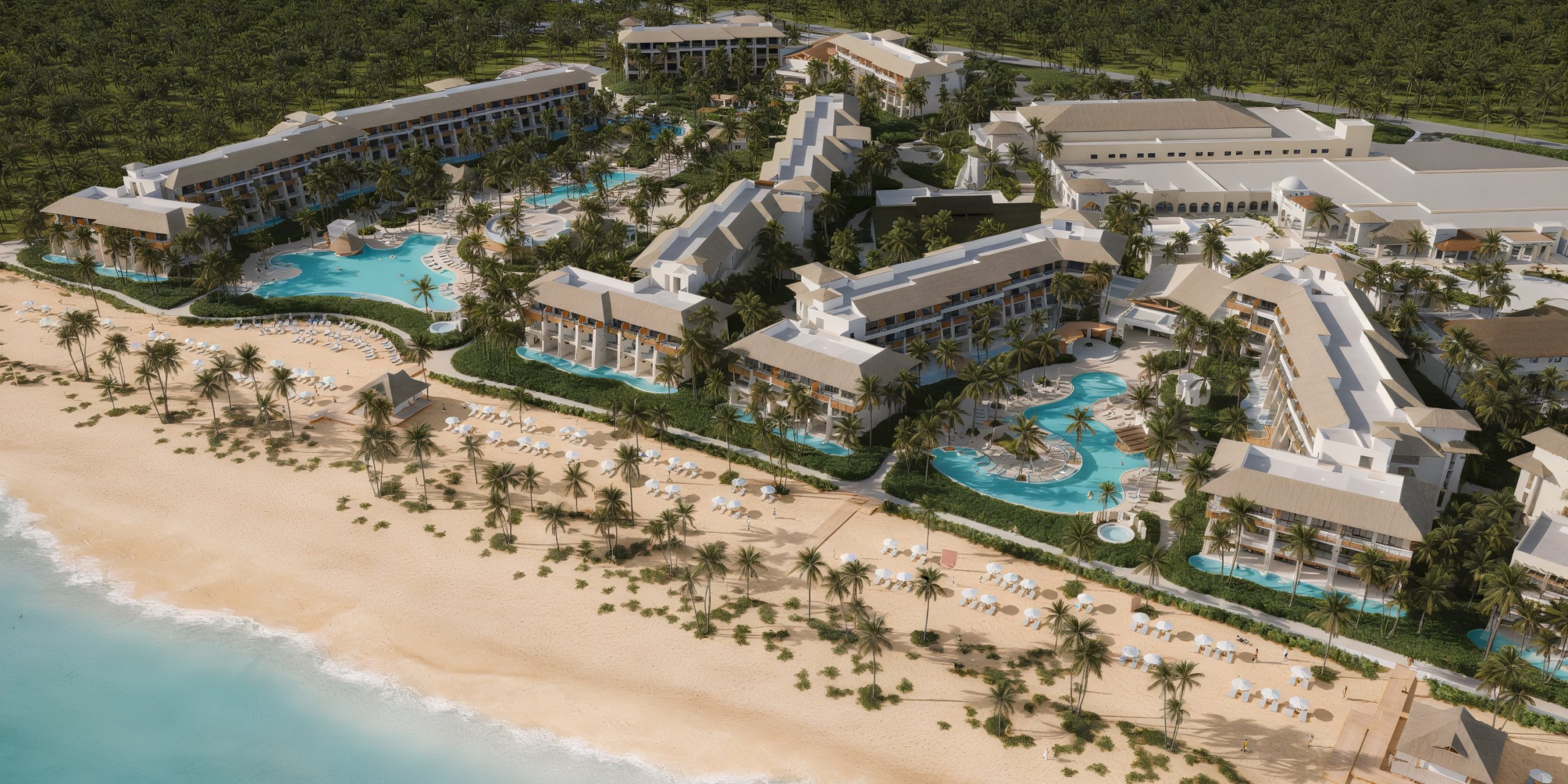 Aerial view of Dreams Playa Esmeralda, a beachfront resort and ideal destination wedding location, featuring stunning pools and swaying palm trees.