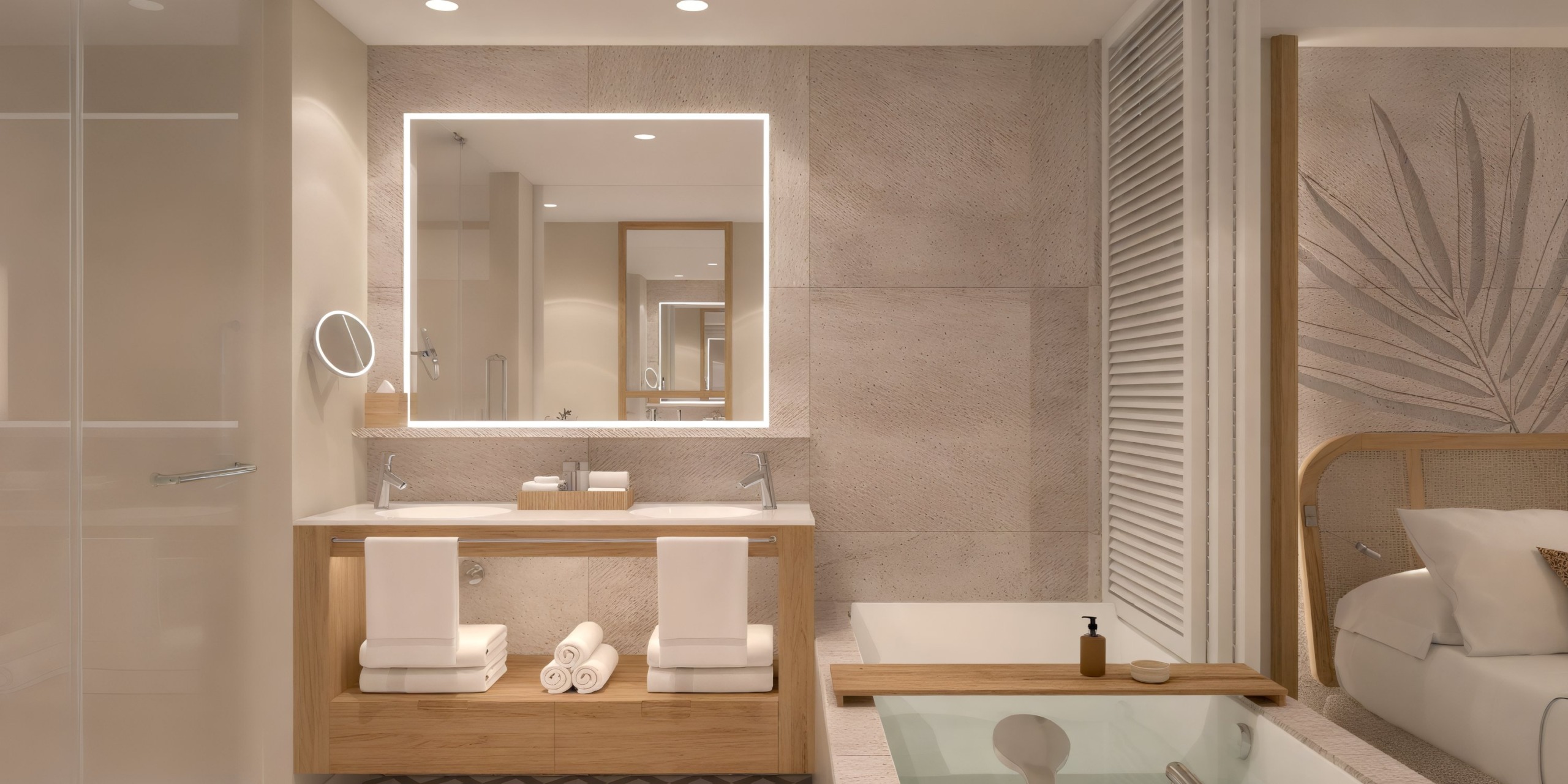 Dreams Playa Esmeralda offers a chic bath perfect for a destination wedding retreat, featuring dual sinks, an illuminated mirror, and a luxurious tub.