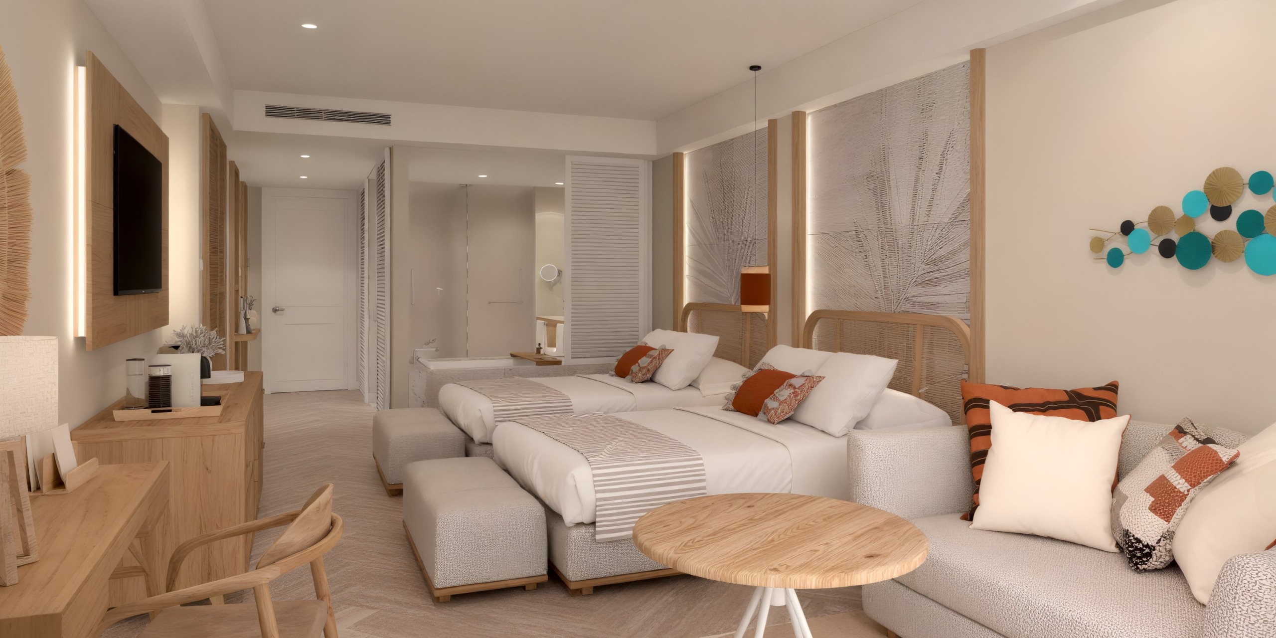 Dreams Playa Esmeralda offers a perfect destination wedding experience with rooms featuring two beds, a cozy sofa, a convenient table, and a wall-mounted TV.