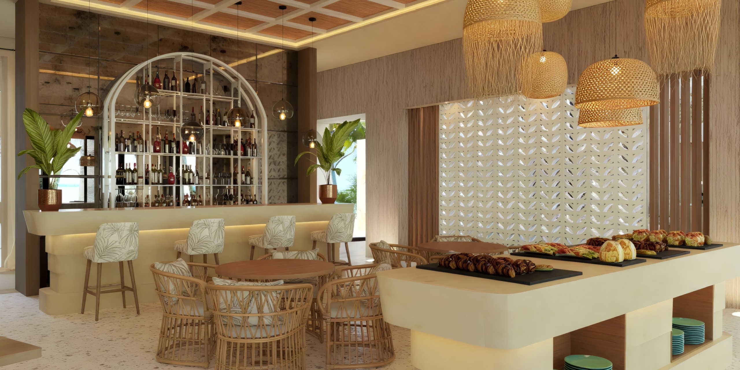 Dreams Playa Esmeralda offers a chic bar featuring wicker seats, round tables, and elegant hanging lights, making it an ideal location for a stylish destination wedding.