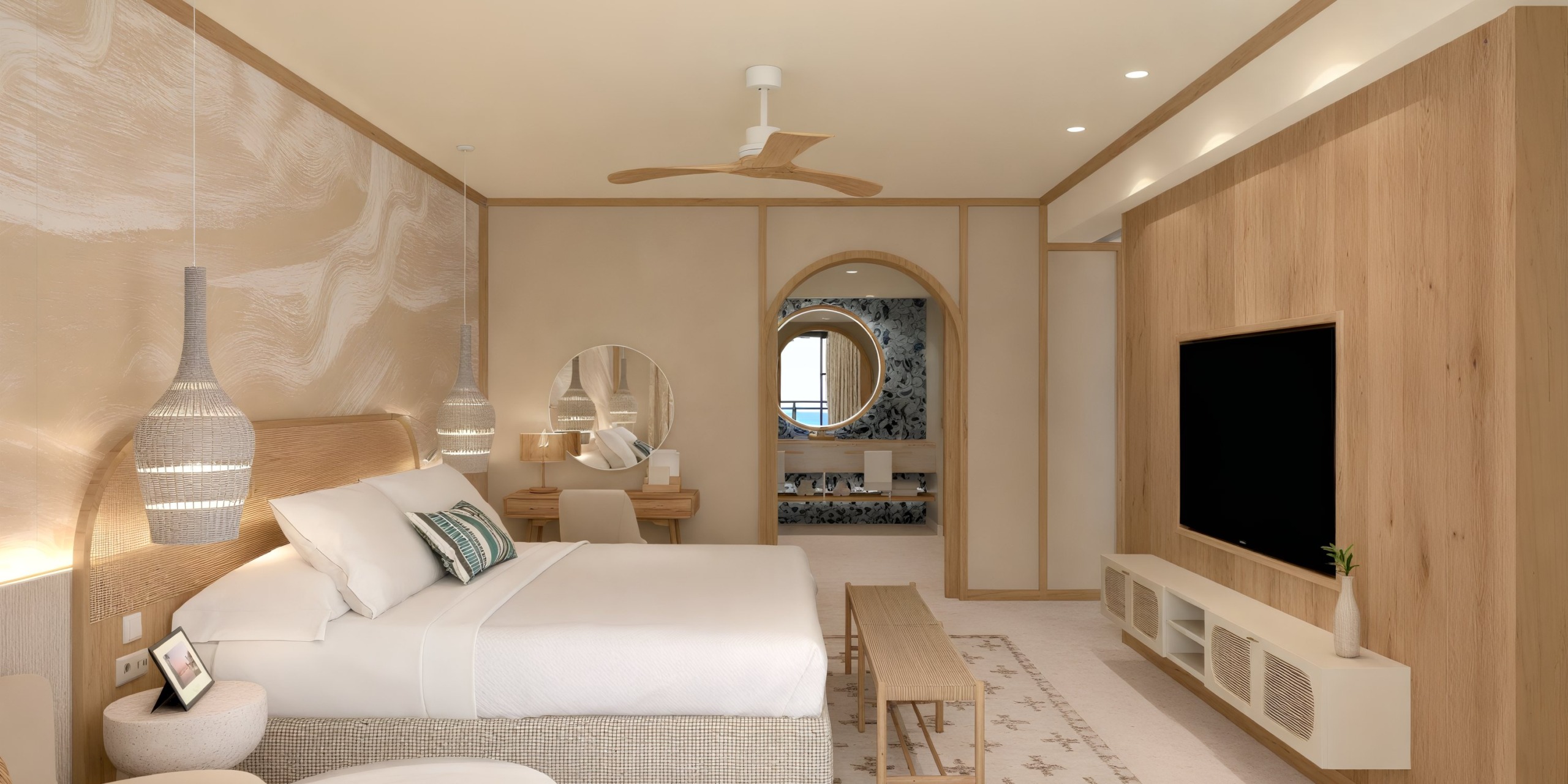 Dreams Playa Esmeralda provides a modern room with elegant wood accents, featuring a comfortable bed, TV, and seating area—perfect for guests attending a destination wedding.