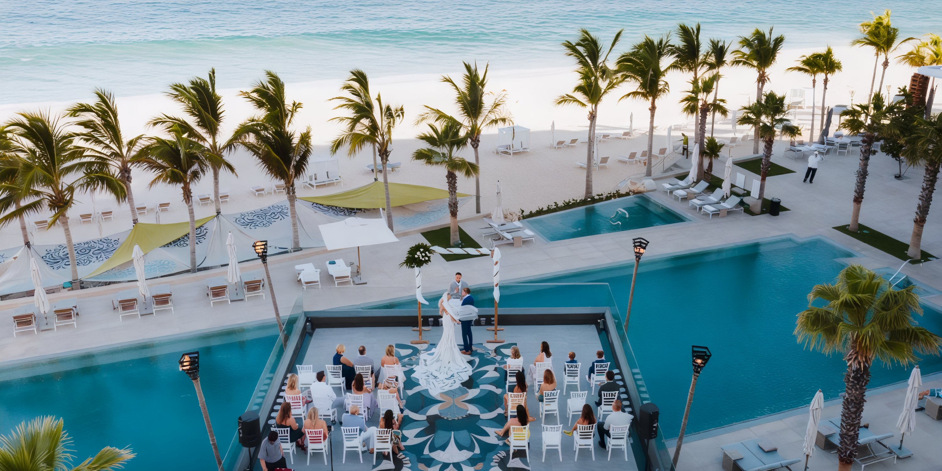 Destination wedding at Garza Blanca Los Cabos featuring a stunning outdoor ceremony with beach views, swaying palm trees, a sparkling pool, and delighted guests.