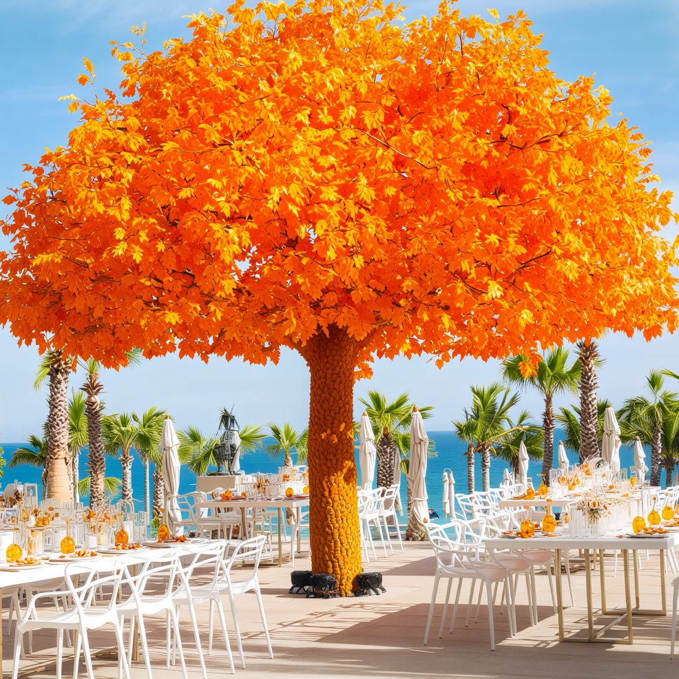 An outdoor dining area featuring an artificial orange tree serves as an enchanting setting under a clear blue sky, perfect for a destination wedding.