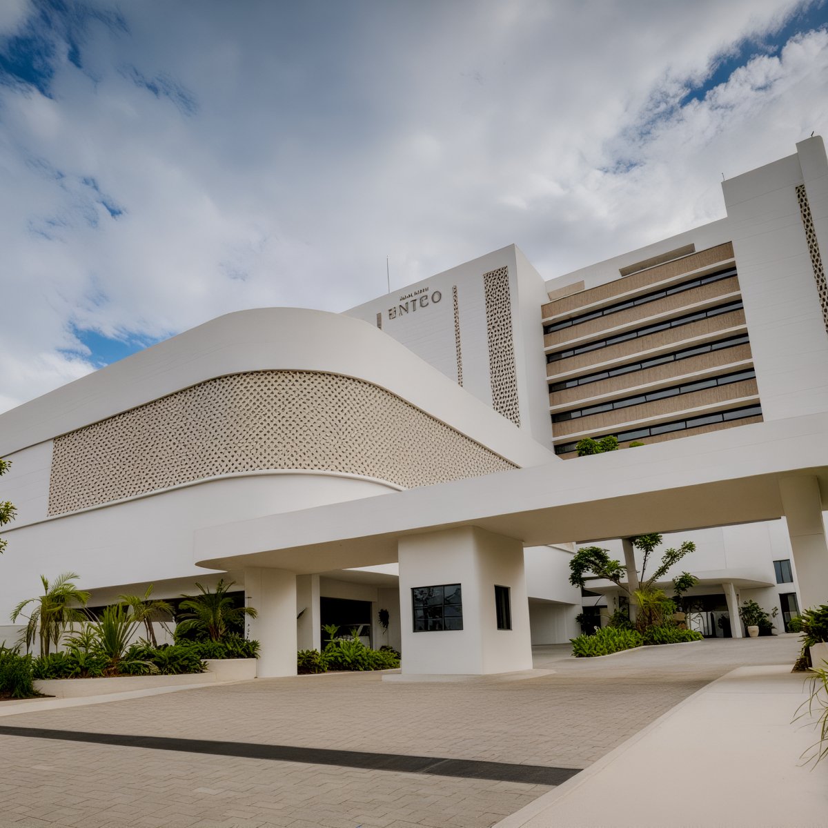 Modern white office building with angular design and palms, a stunning destination wedding venue at UNICO 20°105°.