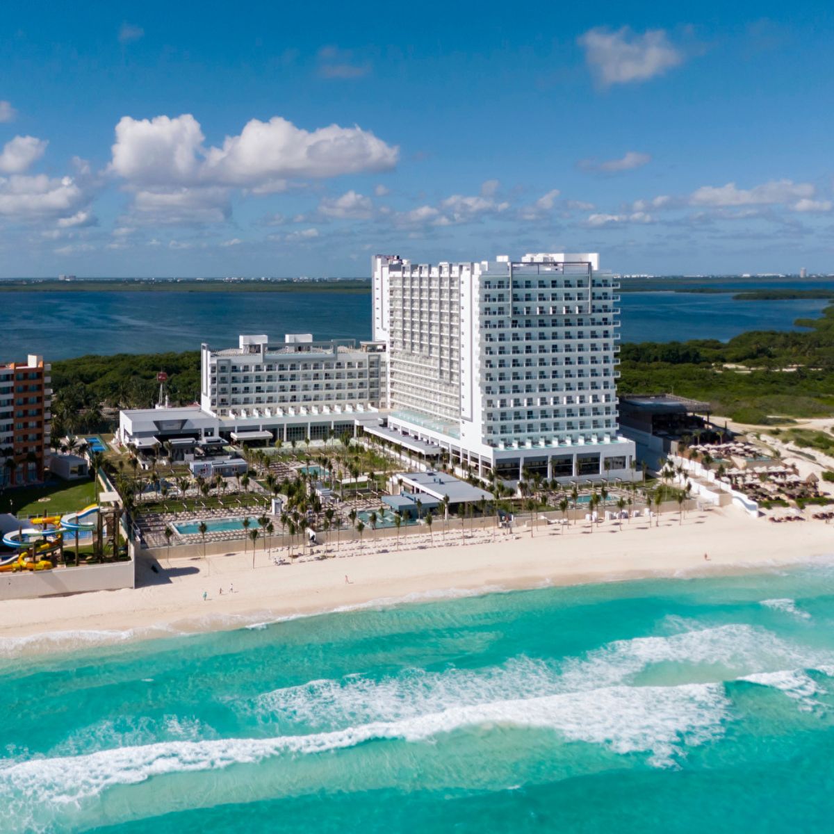 Hotel Riu Ventura: A modern beachfront hotel with pools and palms, perfect for a destination wedding.
