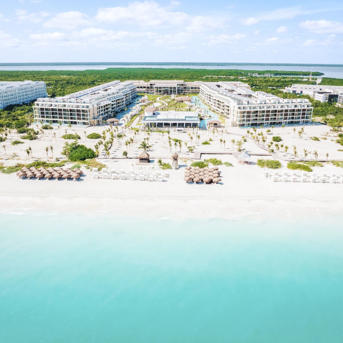 Aerial view of Majestic Mirage Costa Mujeres, perfect for destination weddings with pools and palms.