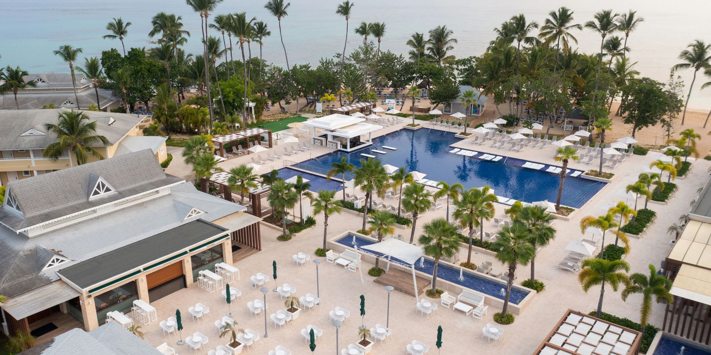 Aerial view of Bahia Principe Grand El Portillo resort pool, perfect for a destination wedding by the beach.