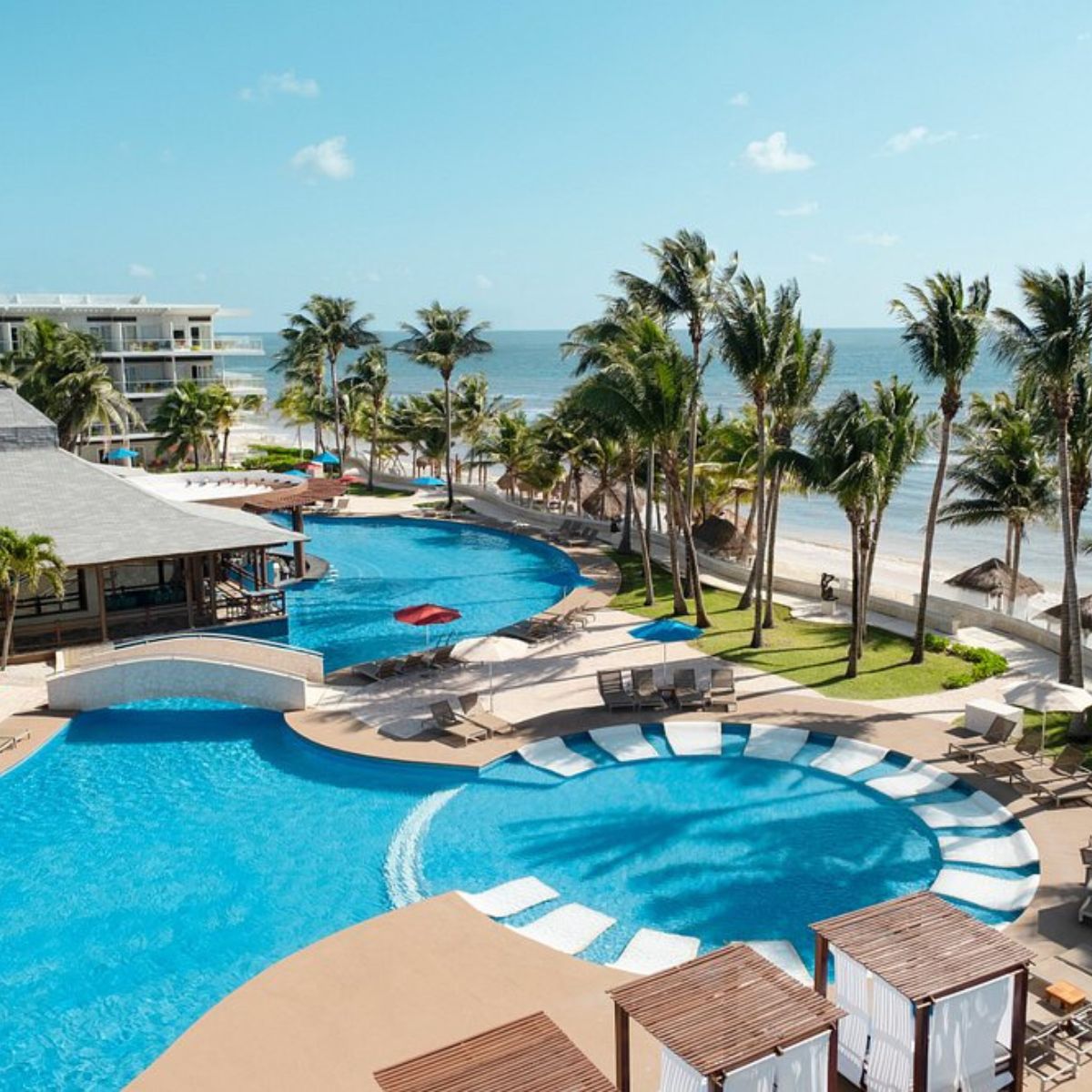 Iberostar Selection Riviera Cancun features pools and beach lounges, perfect for a destination wedding.
