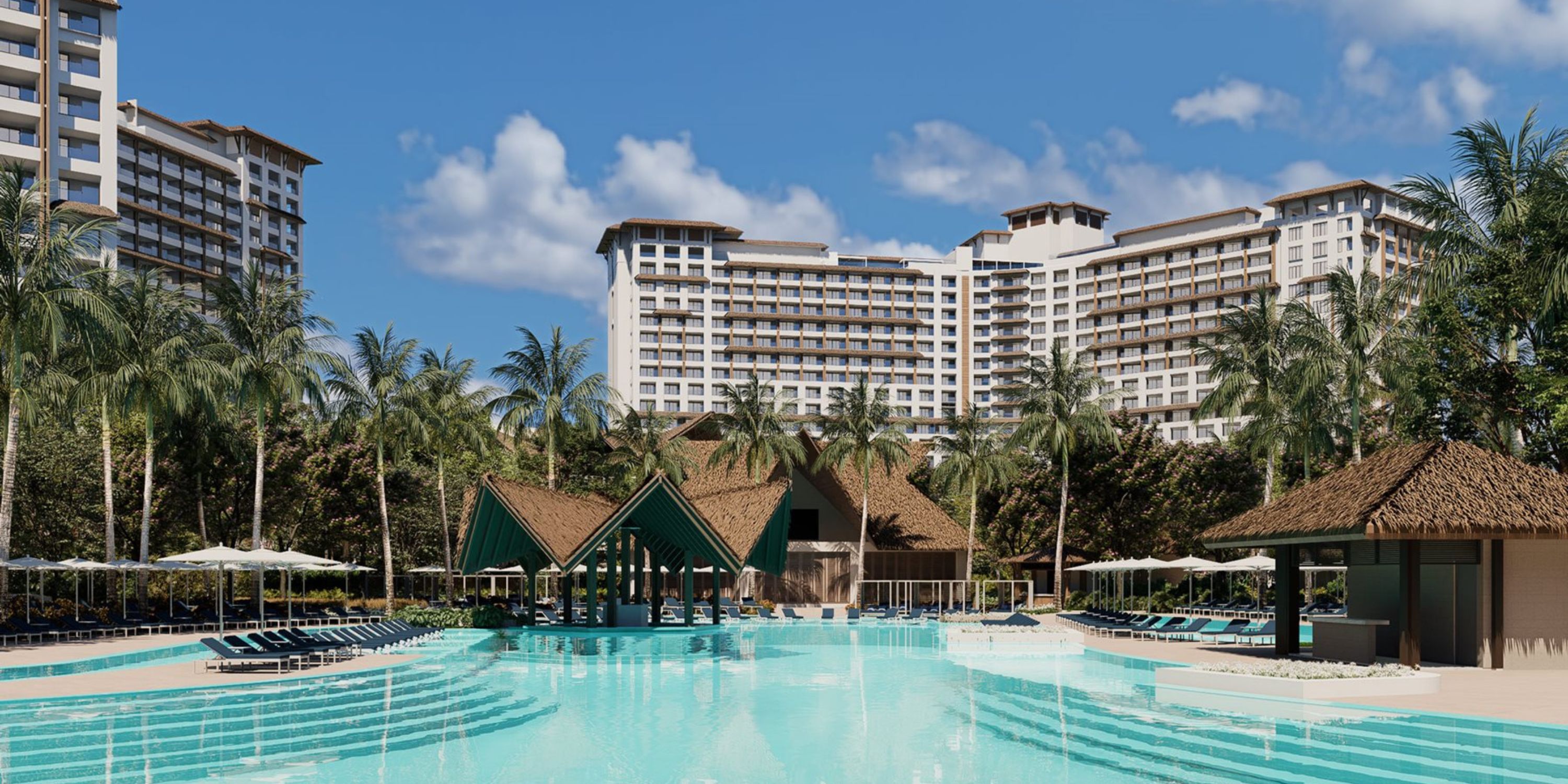 Moon Palace The Grand’s pool, palm trees, and cabanas create a dreamy destination wedding setting.