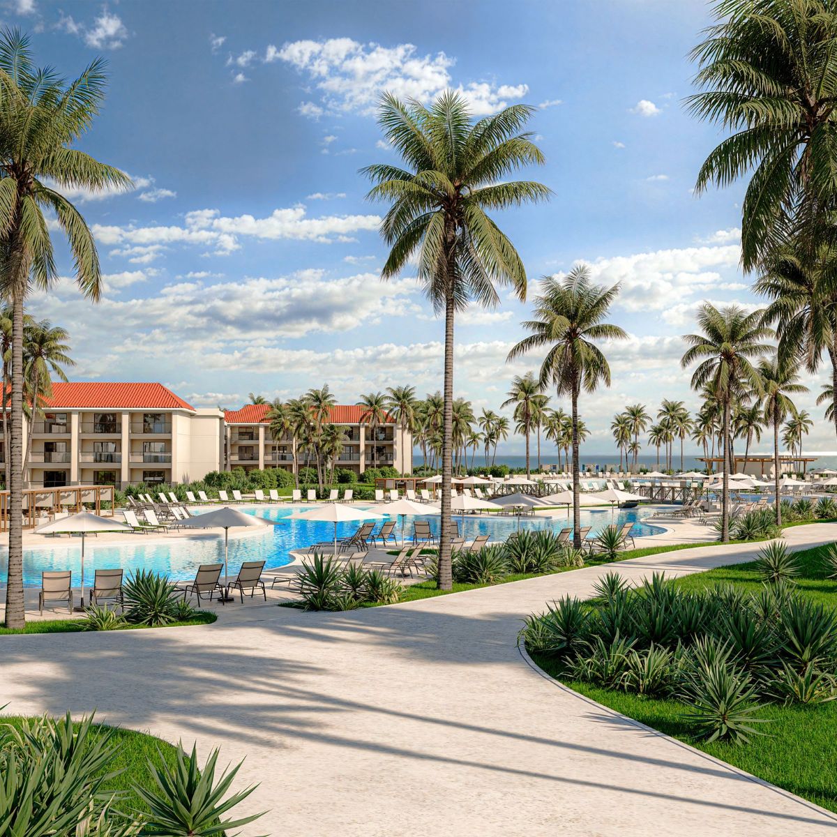 Hyatt Vivid Grand Island: poolside oasis with palm trees, lounge chairs, and ocean views for a wedding.
