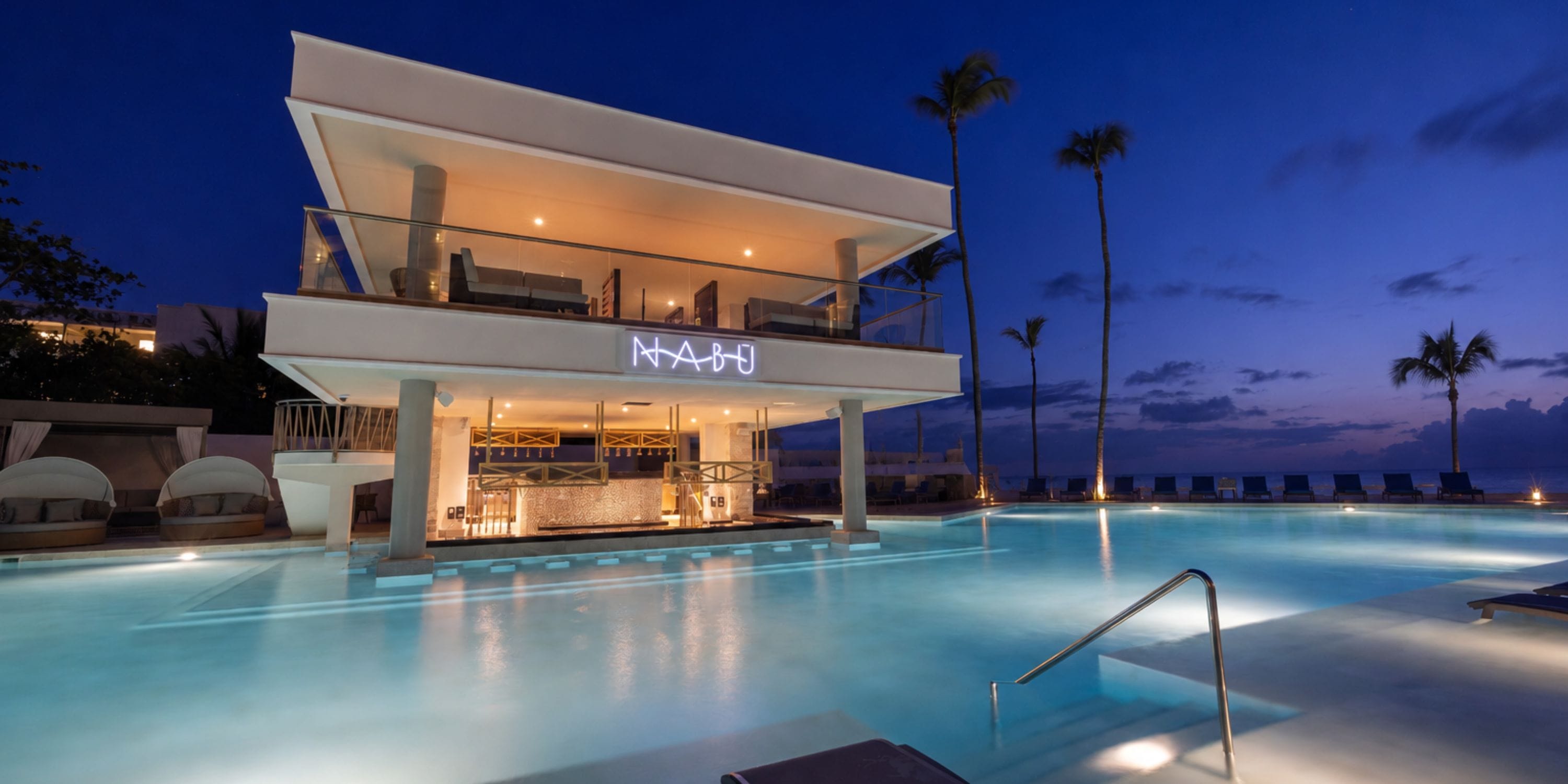 Royalton Vessence Barbados: Poolside bar, lounge, and palm trees—perfect for destination weddings.
