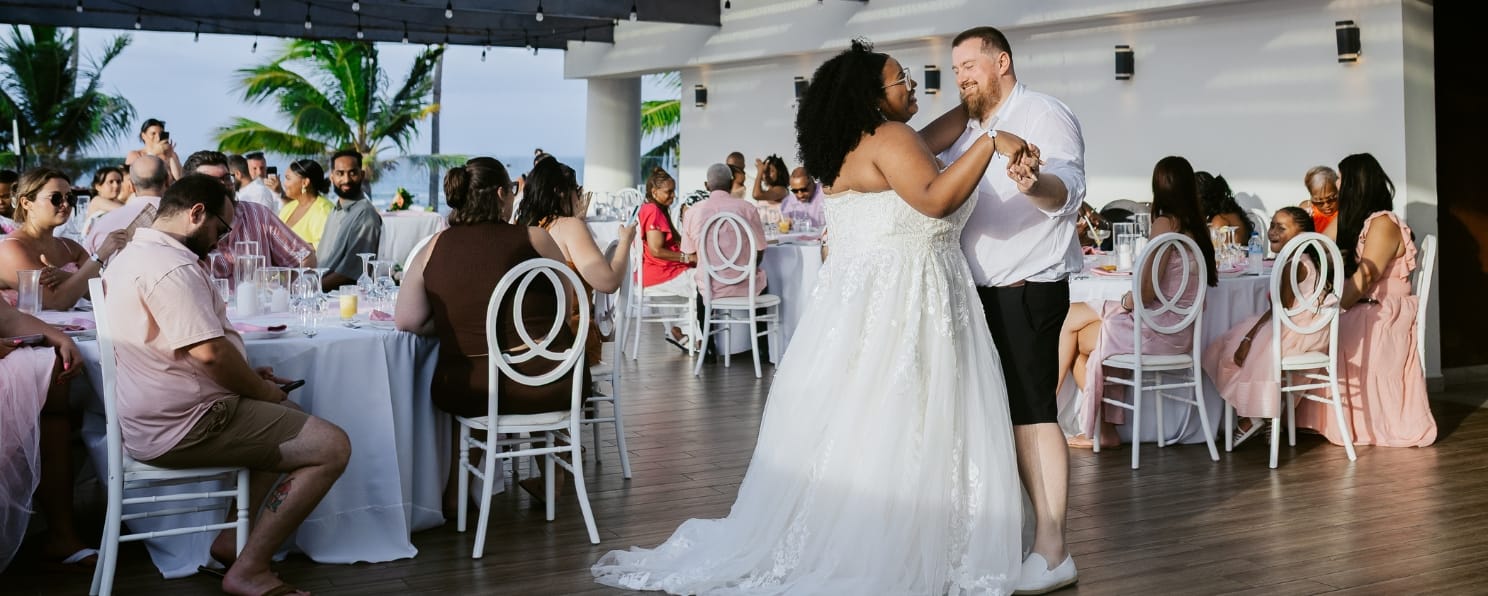 Bride and groom share their first dance at a destination wedding reception.