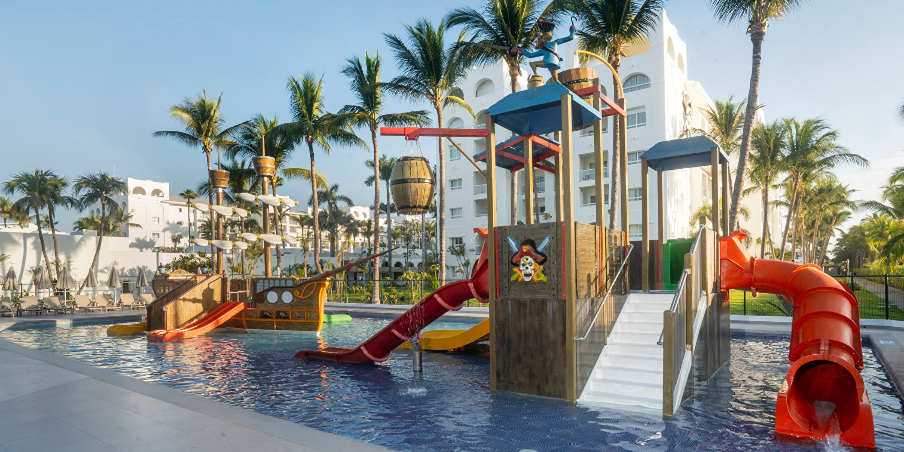 Hotel Riu Jalisco: Destination wedding resort featuring a kids’ water play area with slides and pirate ship.