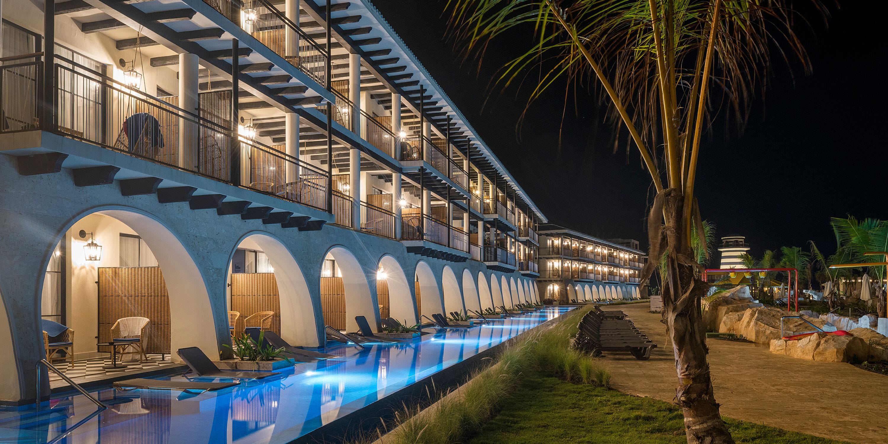 El Beso at Ocean El Faro, ideal for a destination wedding, has arched balconies over a night-lit pool.