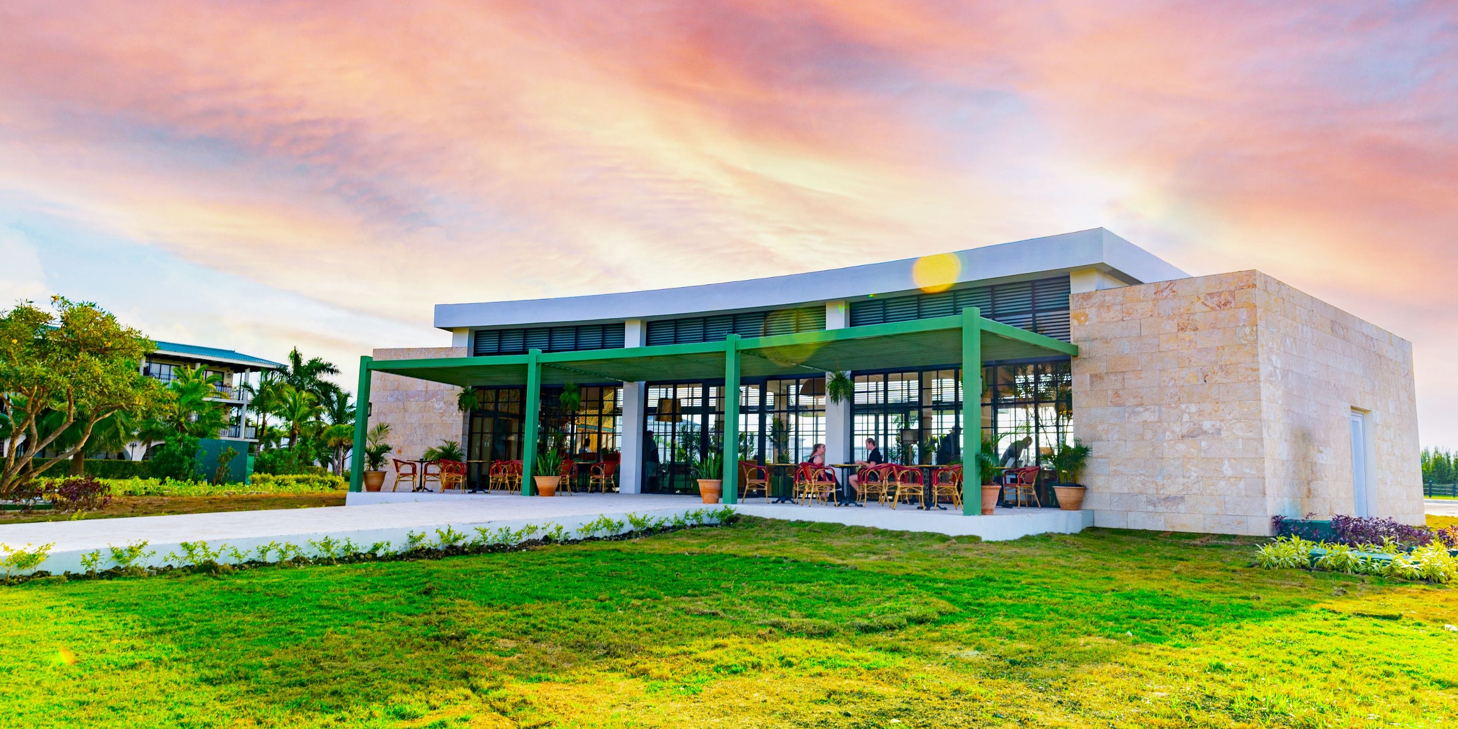 El Beso at Ocean El Faro boasts large windows and outdoor seating, perfect for a destination wedding.