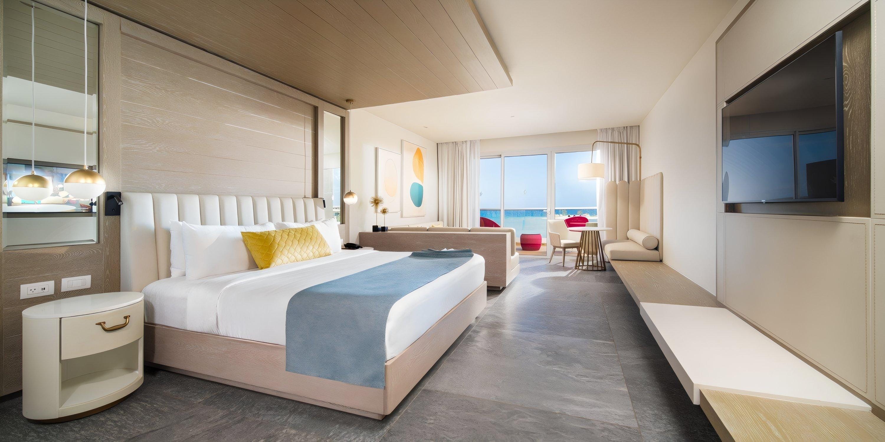 Princess Senses The Mangrove Hotel room: double bed, sofa, desk, balcony with ocean view for destination wedding.