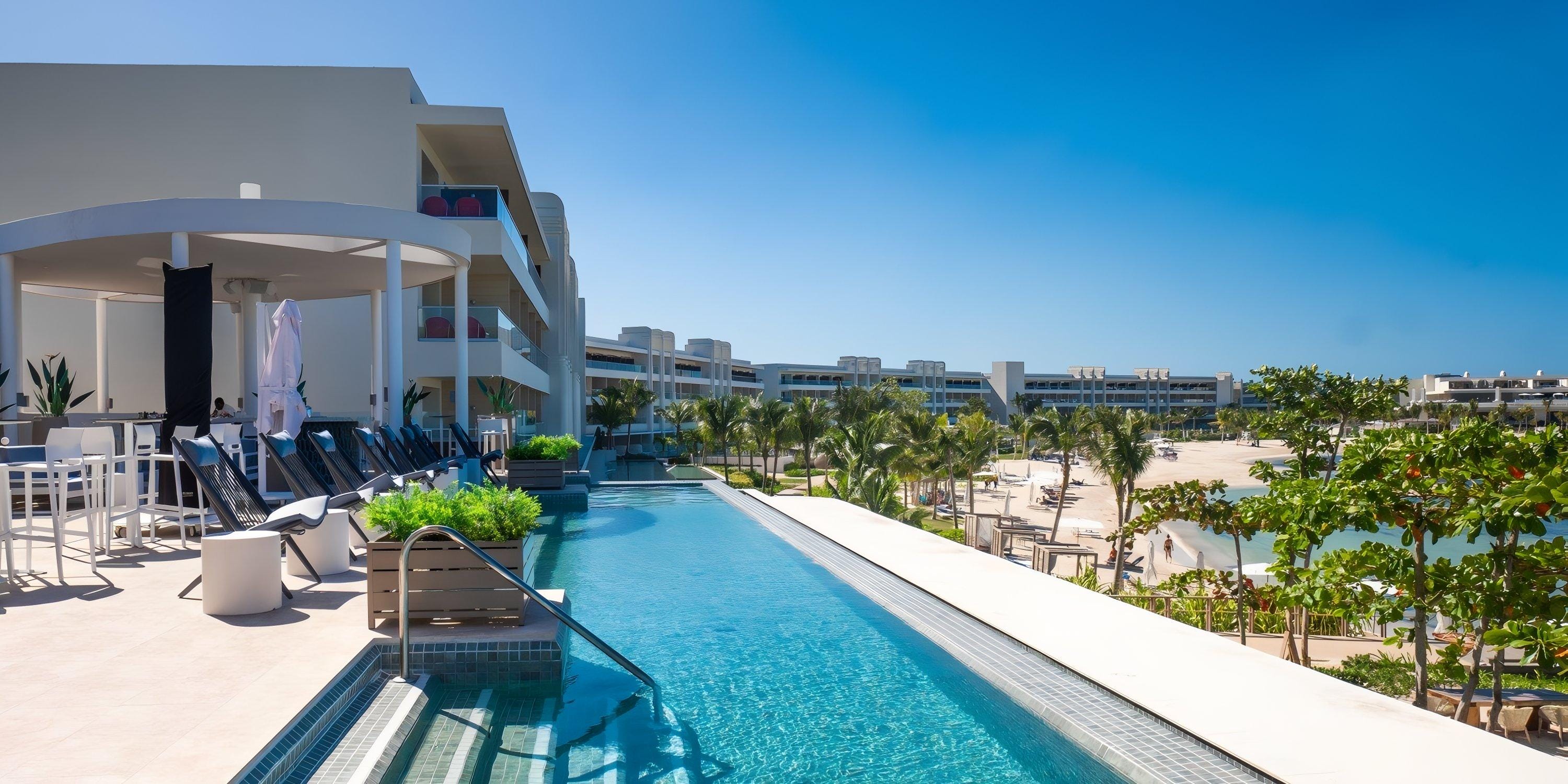 Infinity pool and lounge chairs at Princess Senses The Mangrove Hotel, perfect for a destination wedding.