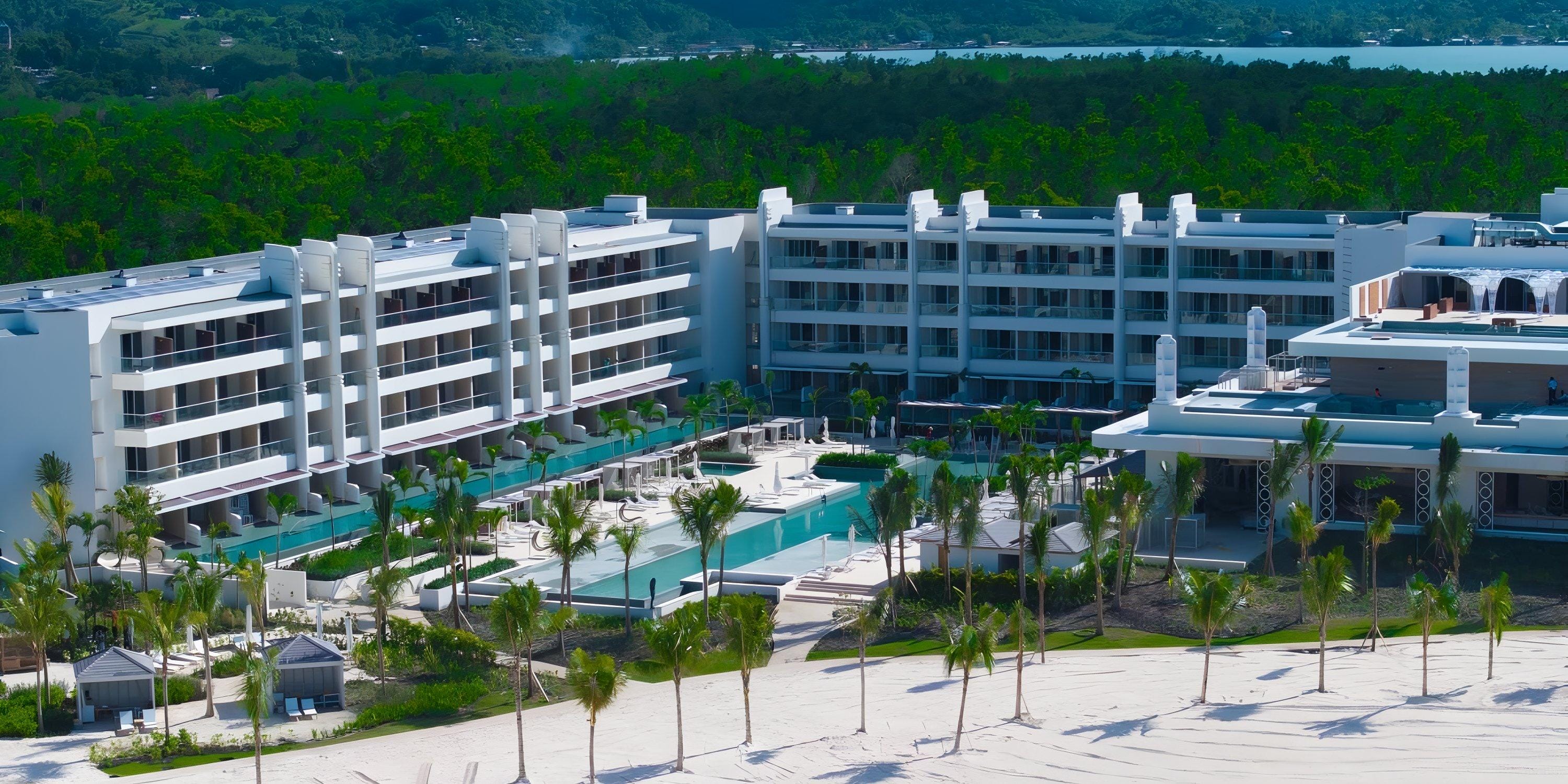 Princess Senses The Mangrove Hotel: a modern beachfront wedding destination with pools and palm trees.