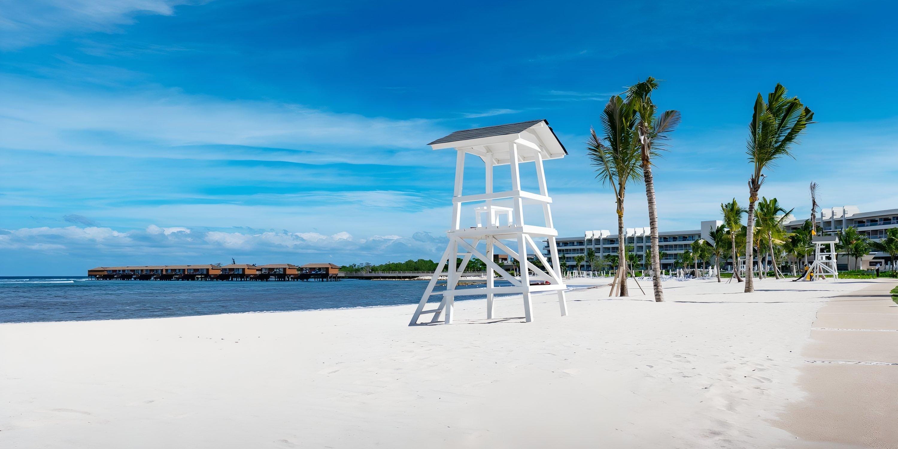 Empty white lifeguard tower on a beach, a serene spot near Princess Senses The Mangrove Hotel, ideal for a destination wedding.
