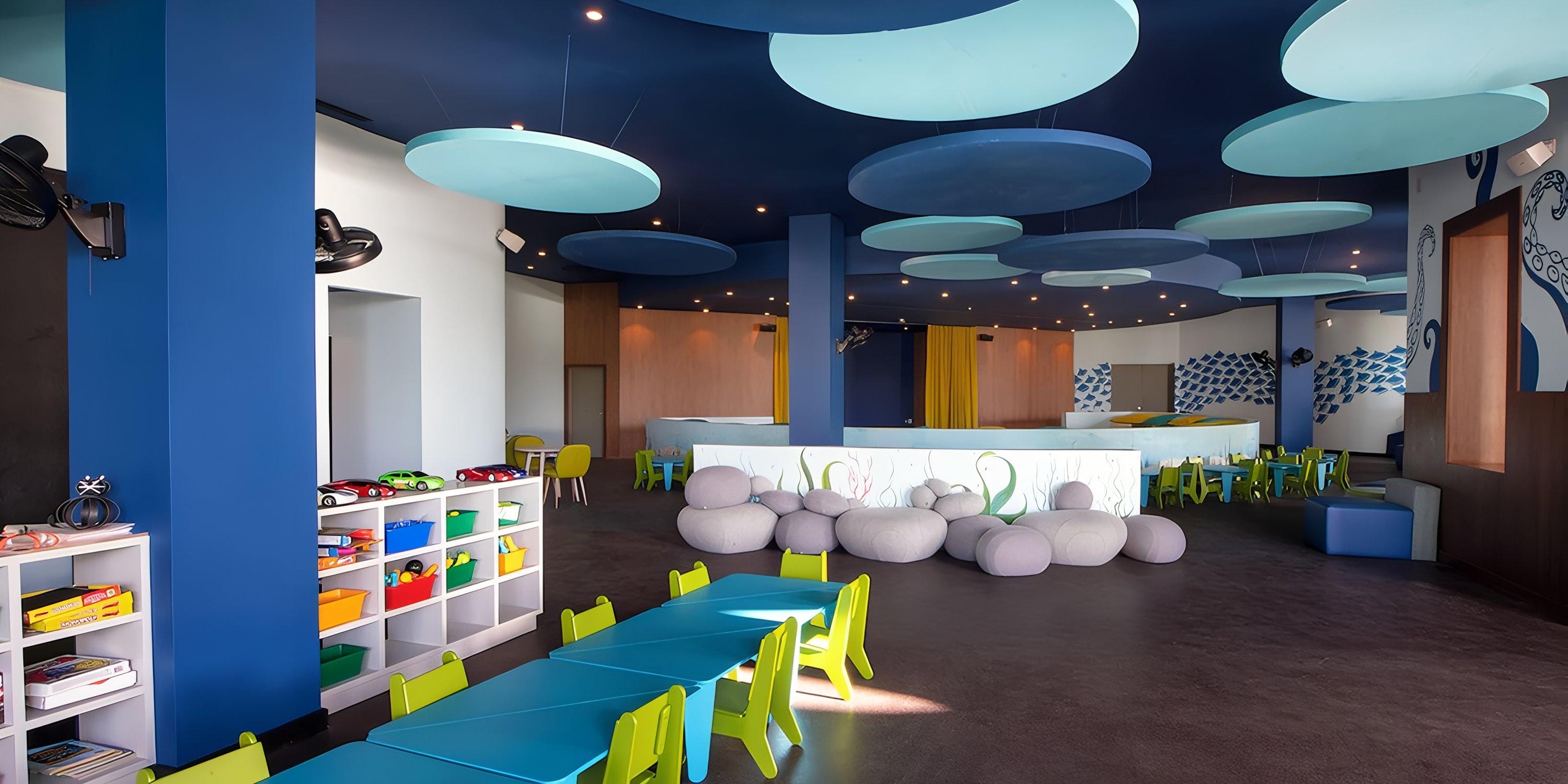 Lopesan Costa Bavaro playroom, ideal for destination wedding kids, with tables, chairs, and decor.