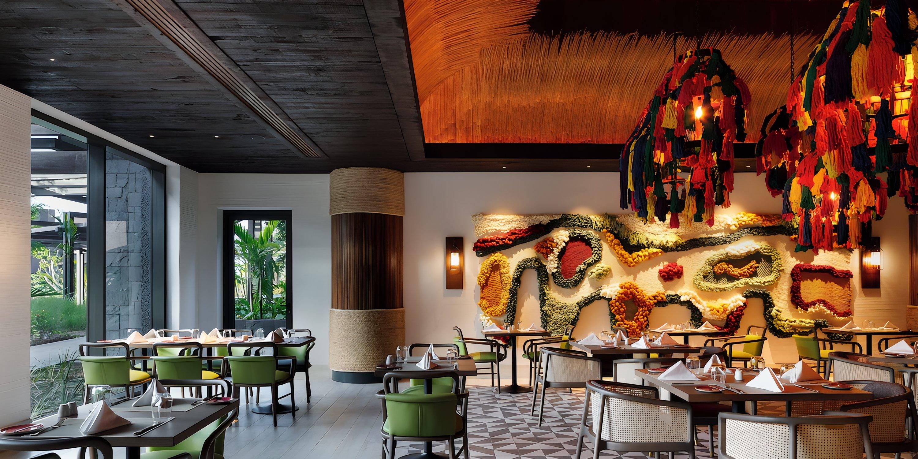 Lopesan Costa Bavaro offers a stylish wedding setting with vibrant art, unique lighting, and elegant tables.