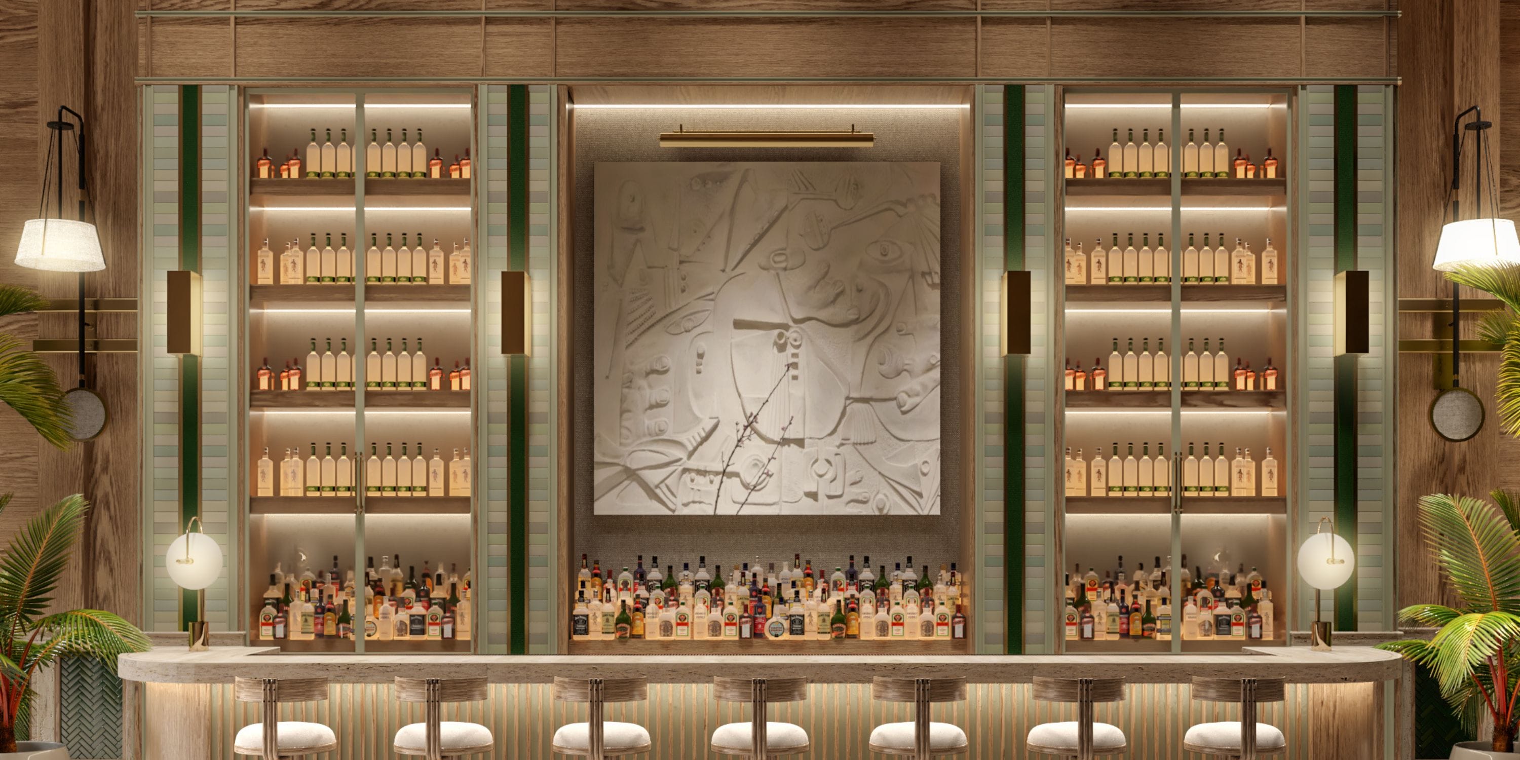 UNICO 18°77° Montego Bay bar for destination wedding, with shelves, art, and five barstools.