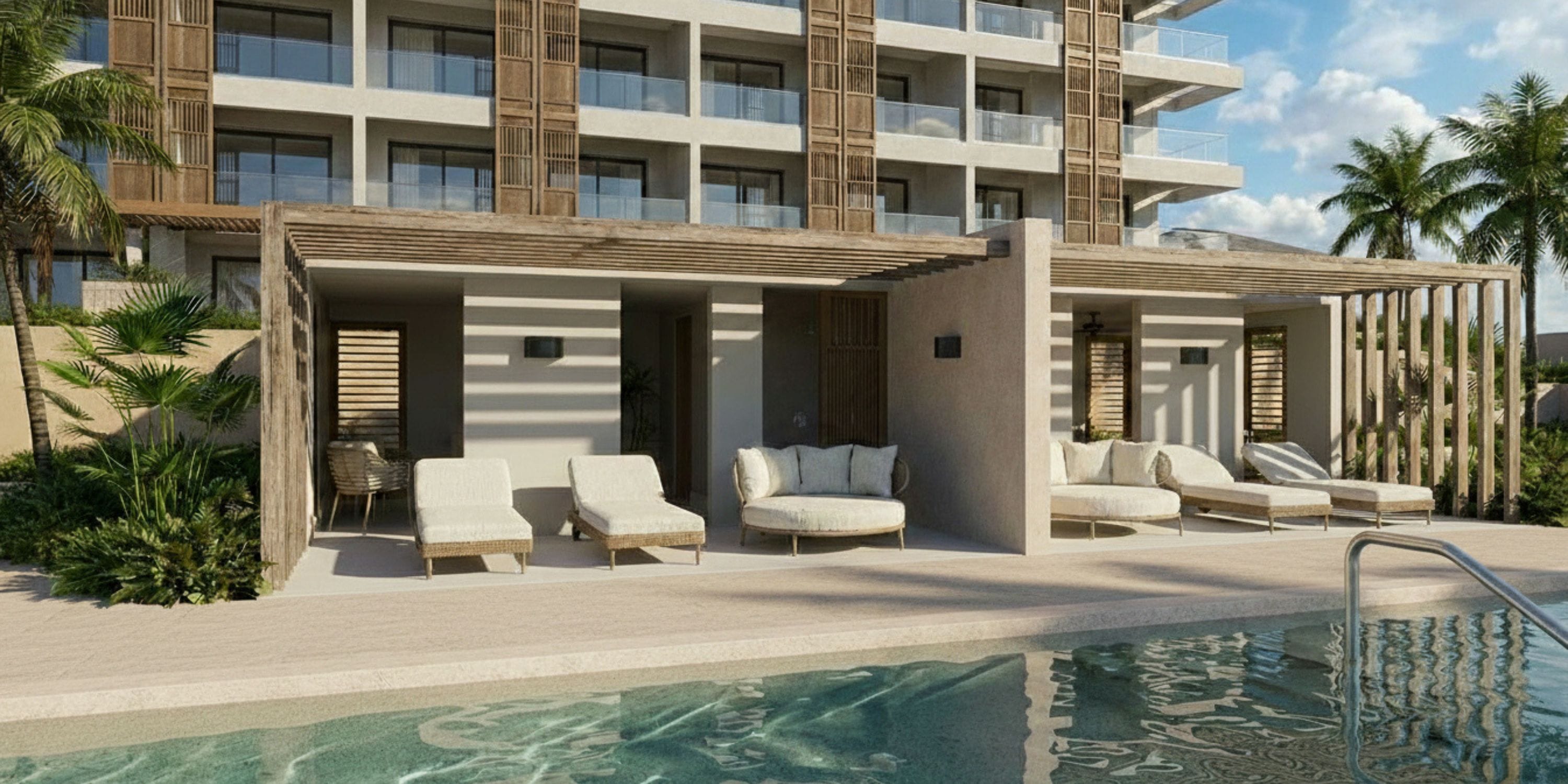 Cabanas and lounge chairs at UNICO 18°77°, perfect for a destination wedding by palms and hotel.